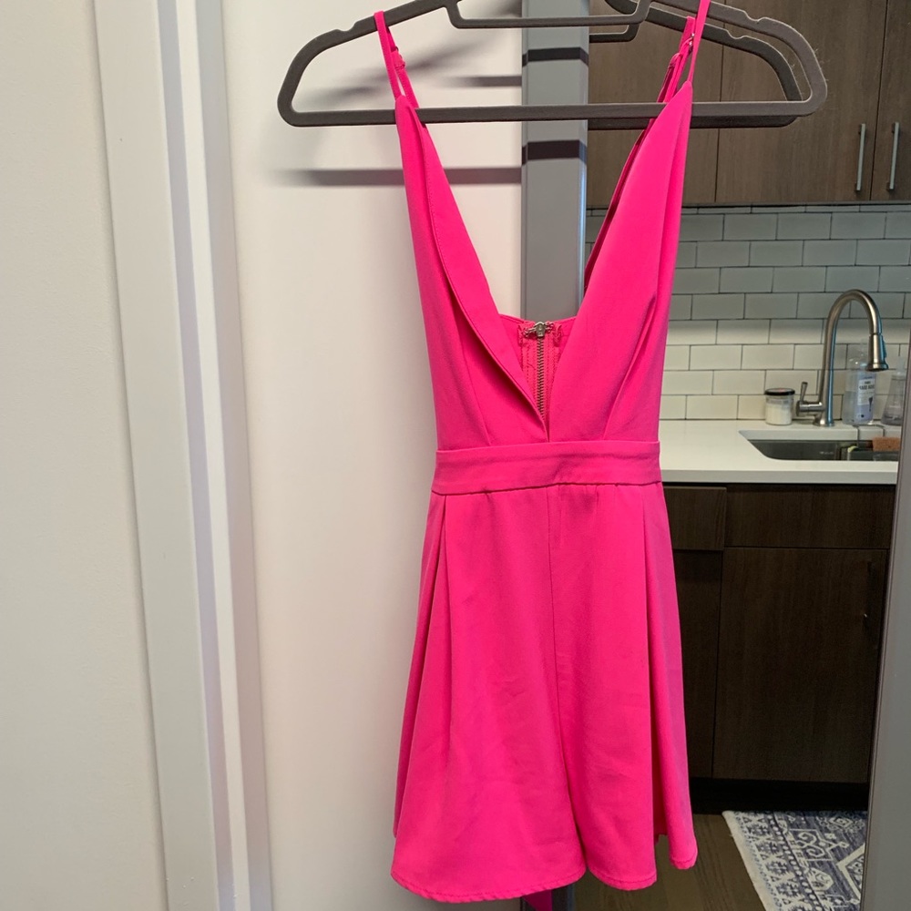 L’ATISTE hot pink low cut romper.